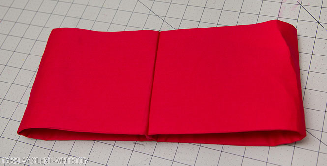 Red fabric sewn together as a loop