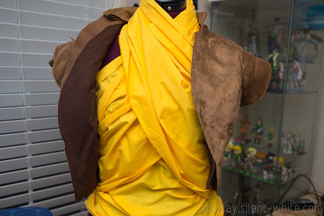 Close up of brown vest with suede fabric and cotton lining